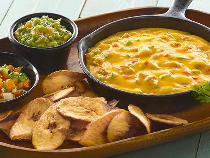 Queso Fundido with Plantain Chips with Trio Cheese Sauce