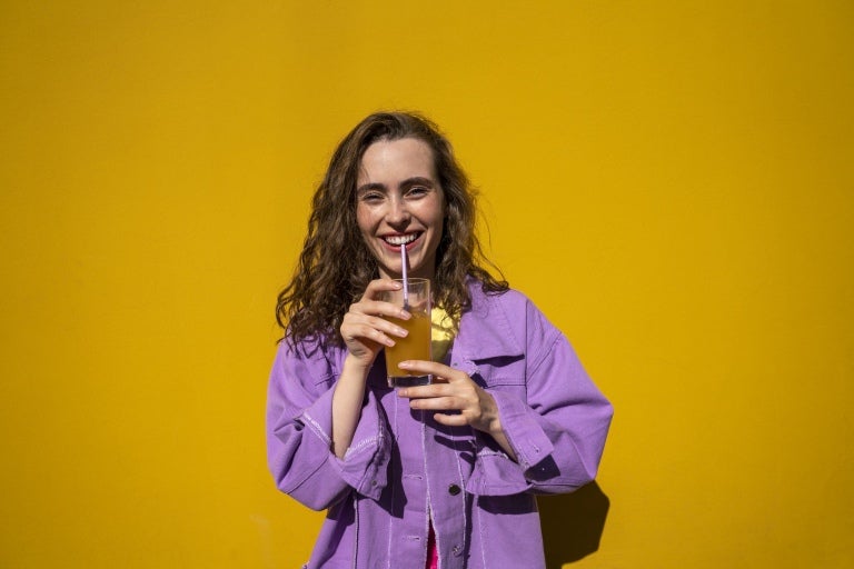 A girl drinking an iced tea